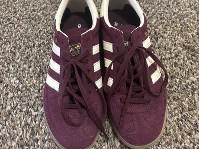 Adidas Handball Spezial in a maroon suede colorway with white stripes woman’s 6.5