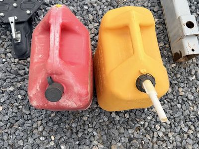 Red & Yellow Plastic Gas Cans - Durable Fuel Storage for Outdoor Equipment