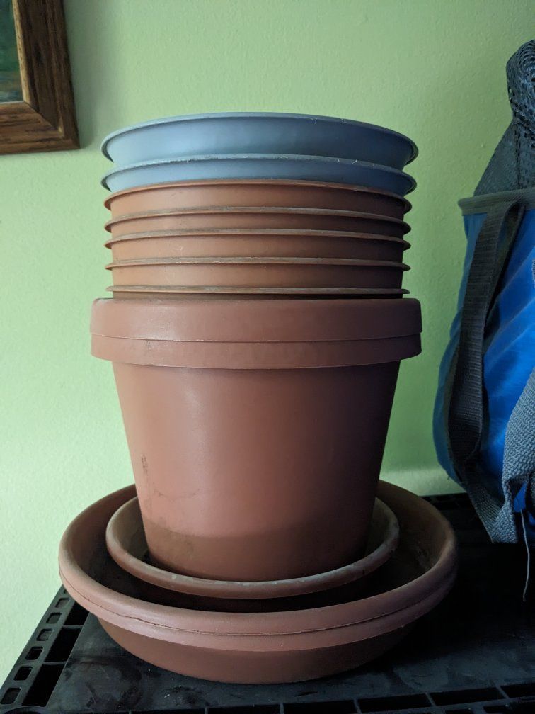 9 - 7 inch tall pots with three water trays