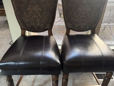 Four gently used bar chairs