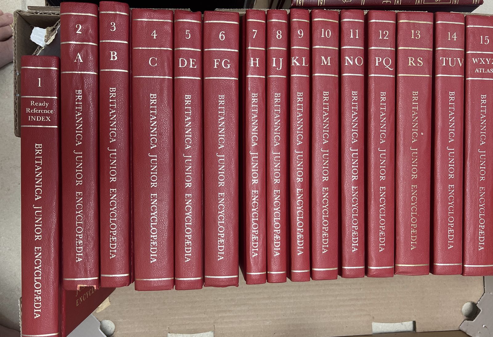 This is a complete 15-volume set of the "Britannica Junior Encyclopædia" (red hardcovers with gold spine lettering).
