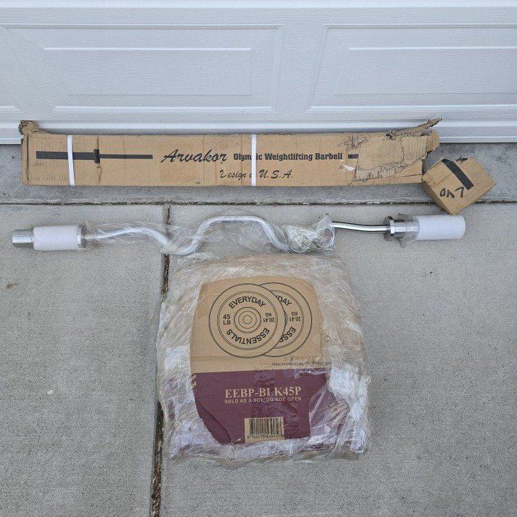 SET OF 45 LB WEIGHT PLATES AND 48" CURL BAR