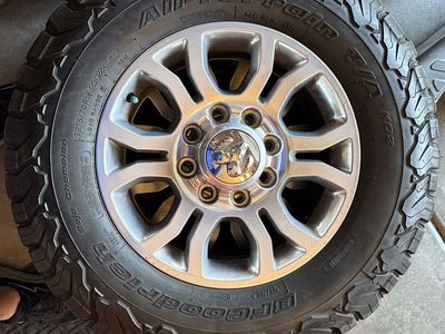 2018 Ram 2500 OEM stock 18" silver alloy wheels with BFGoodrich All-Terrain T/A KO2 LT275/70R18 Load Range E tires.