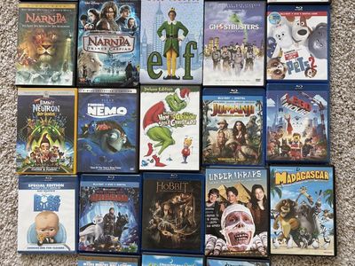 Kid’s DVD/BluRay Collection, includes Elf, Shrek, Shrek II, How to Train Your Dragon, Finding Nemo, and Moana.