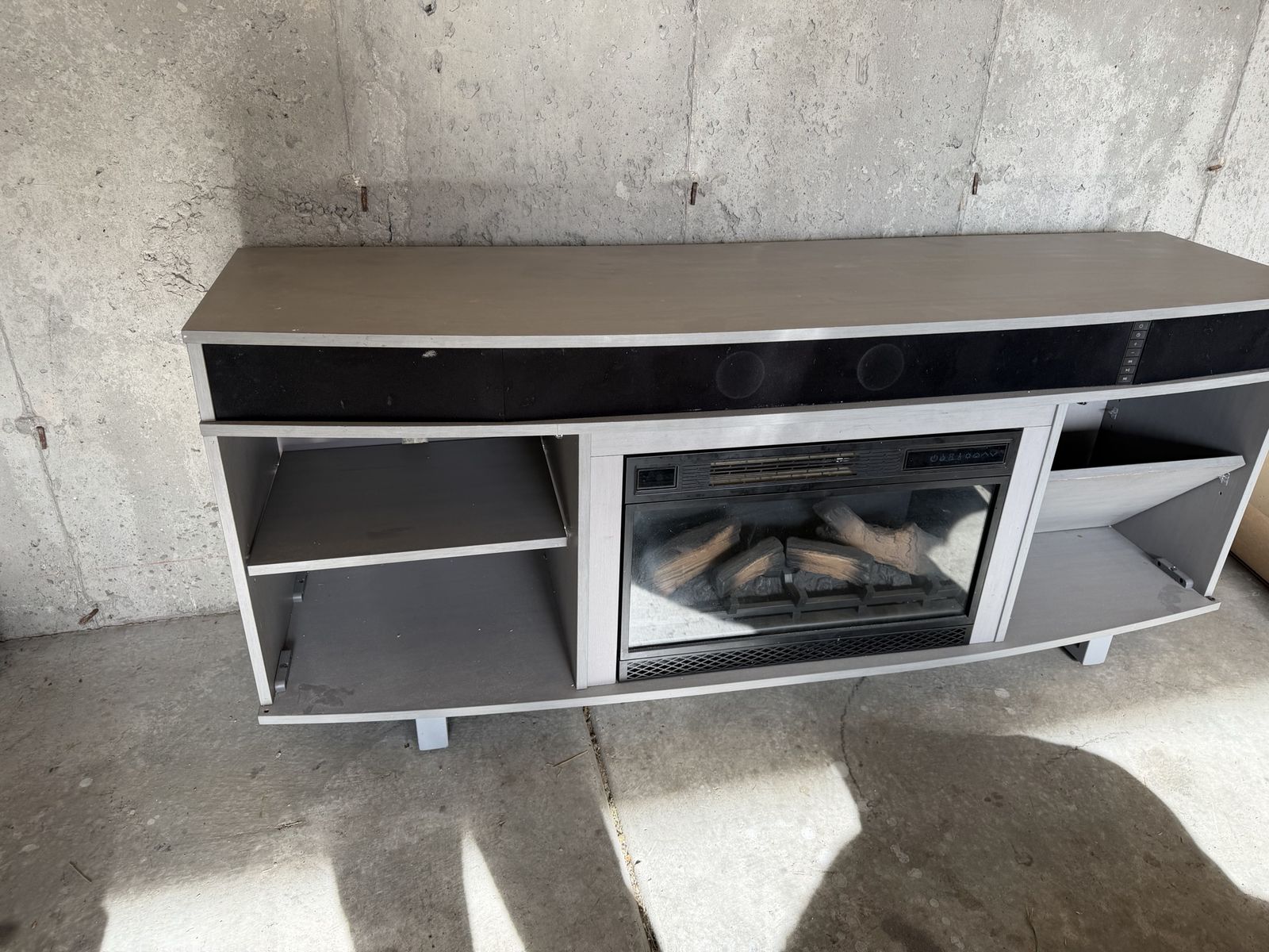 Tv stand with fireplace and sound bar