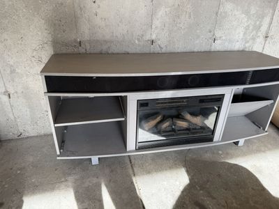 Tv stand with fireplace and sound bar