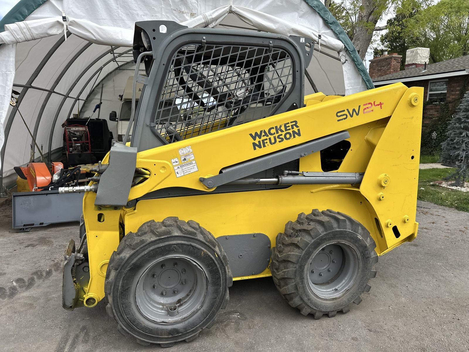 Wacker Neuson SW24 Skid Steer Loader with Bucket - Heavy Duty Construction Equipment