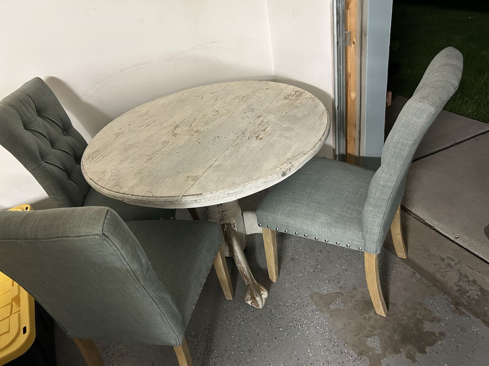 Rustic Distressed Round Dining Table with Three Upholstered Chairs