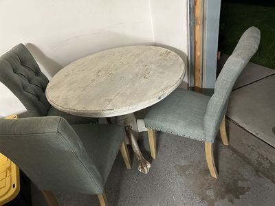 Rustic Distressed Round Dining Table with Three Upholstered Chairs
