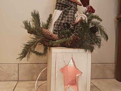 Handmade wooden snowman with light