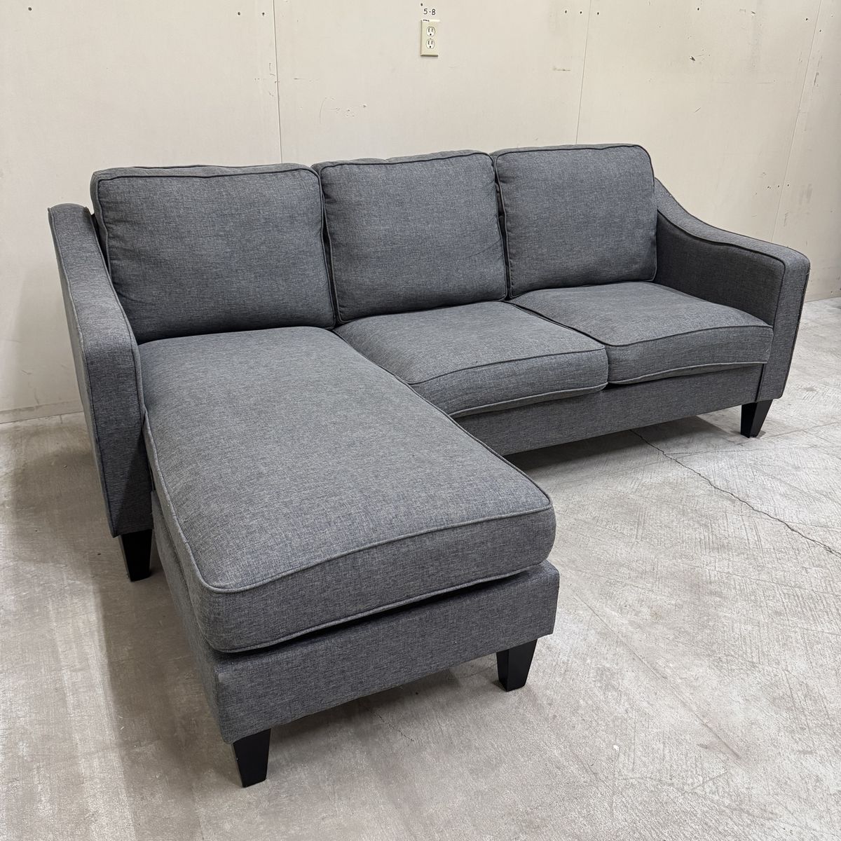 Free Delivery - Reversible Dark Gray Sectional Couch