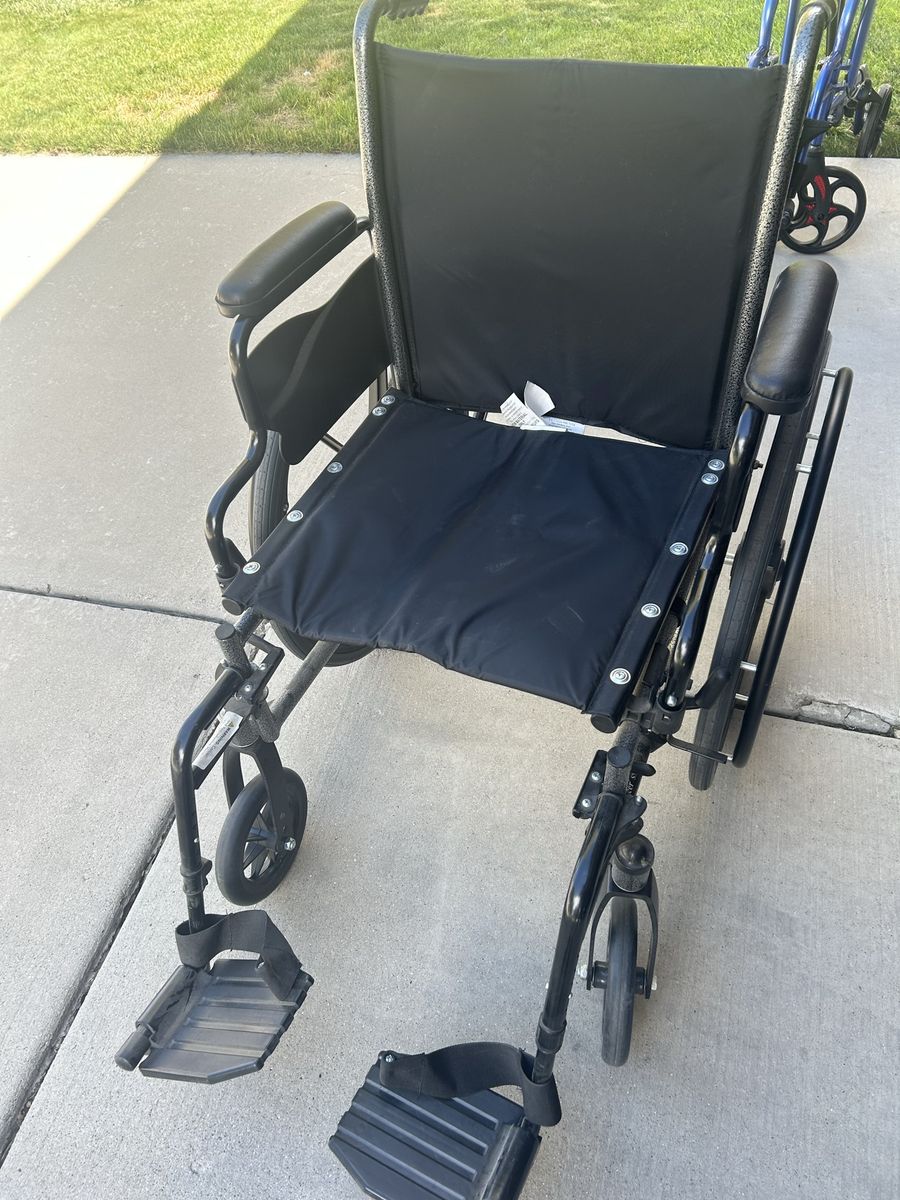 Invacare SX5 Wheelchair with Black Upholstery and Armrests