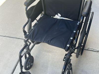Invacare SX5 Wheelchair with Black Upholstery and Armrests