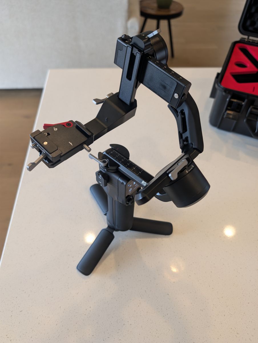 DJI RS 3 Mini 3-Axis Gimbal stabilizer for mirrorless camera, with hard shell carry case.