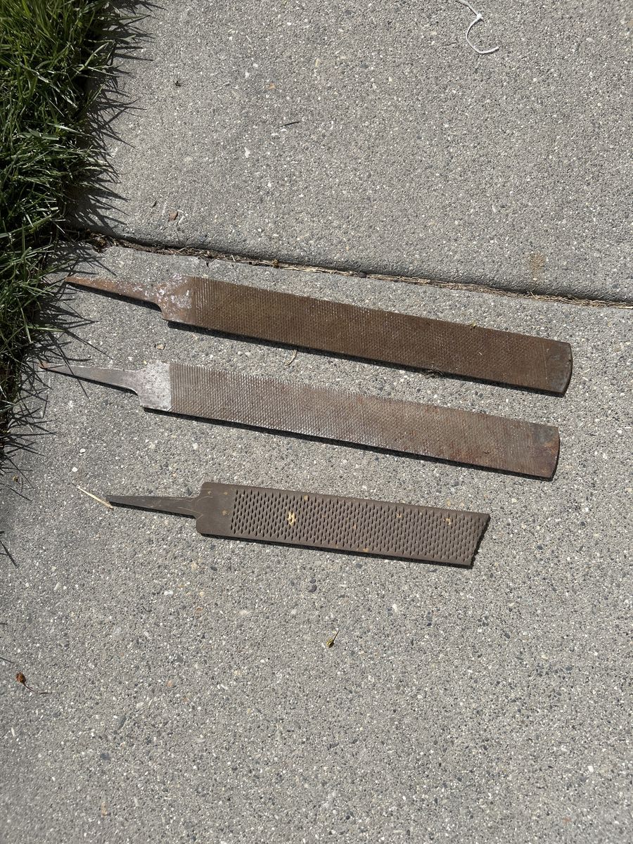 5  Metal Rasps and Half A Bucket If Horse Shoes