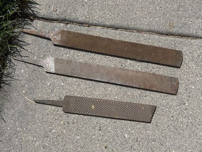 5 Metal Rasps and Half A Bucket If Horse Shoes