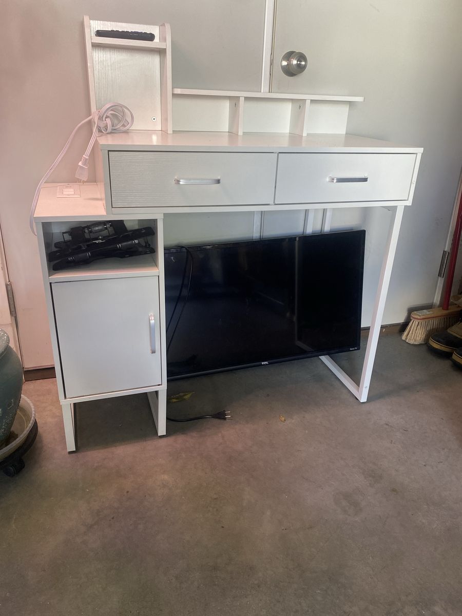 Children desk and 30” TClL Roku Tv with swivel wall mount