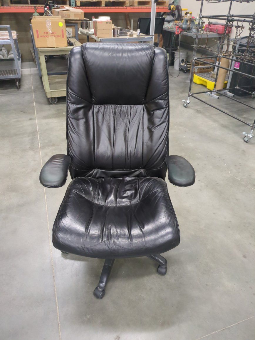 Used Black Leather Executive Office Chair with Armrests and Wheels