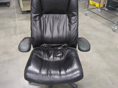 Used Black Leather Executive Office Chair with Armrests and Wheels