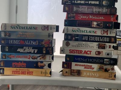 VHS Tapes: Pearl Harbor, Singin' in the Rain (Deluxe), The River, Sleeping Beauty, My Fair Lady, Halloween H20, Jerry Maguire
