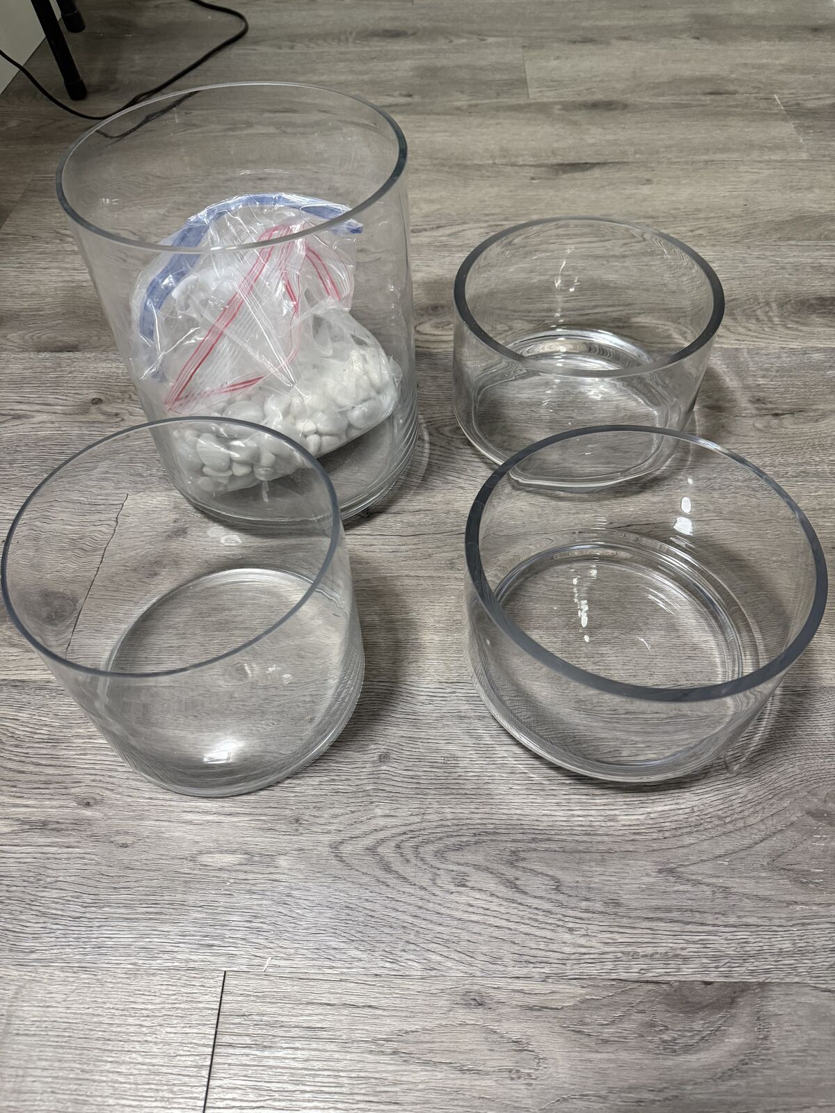 Glass planters and white stones