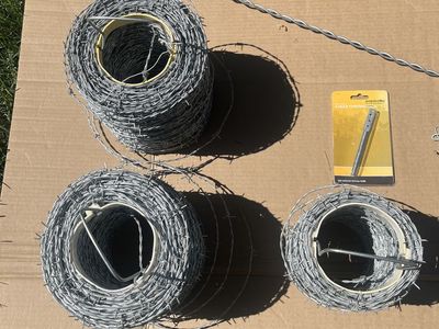 Barbed Wire 18-guage 4-point, approx 2200 ft. Unused. Plus some extras
