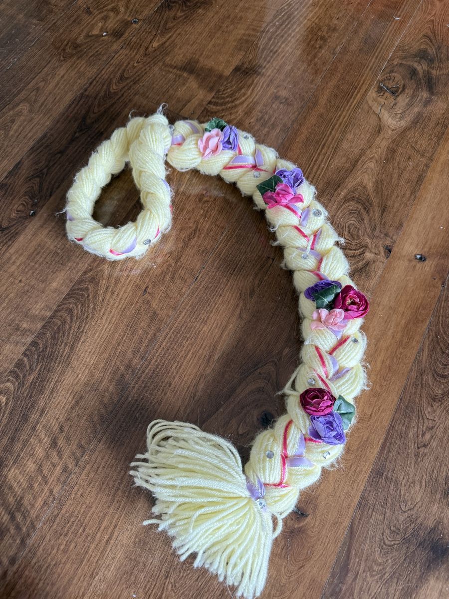 Kids sized homemade Rapunzel yarn braid with flowers