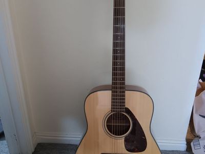 Yamaha FG700S acoustic with Gator case.