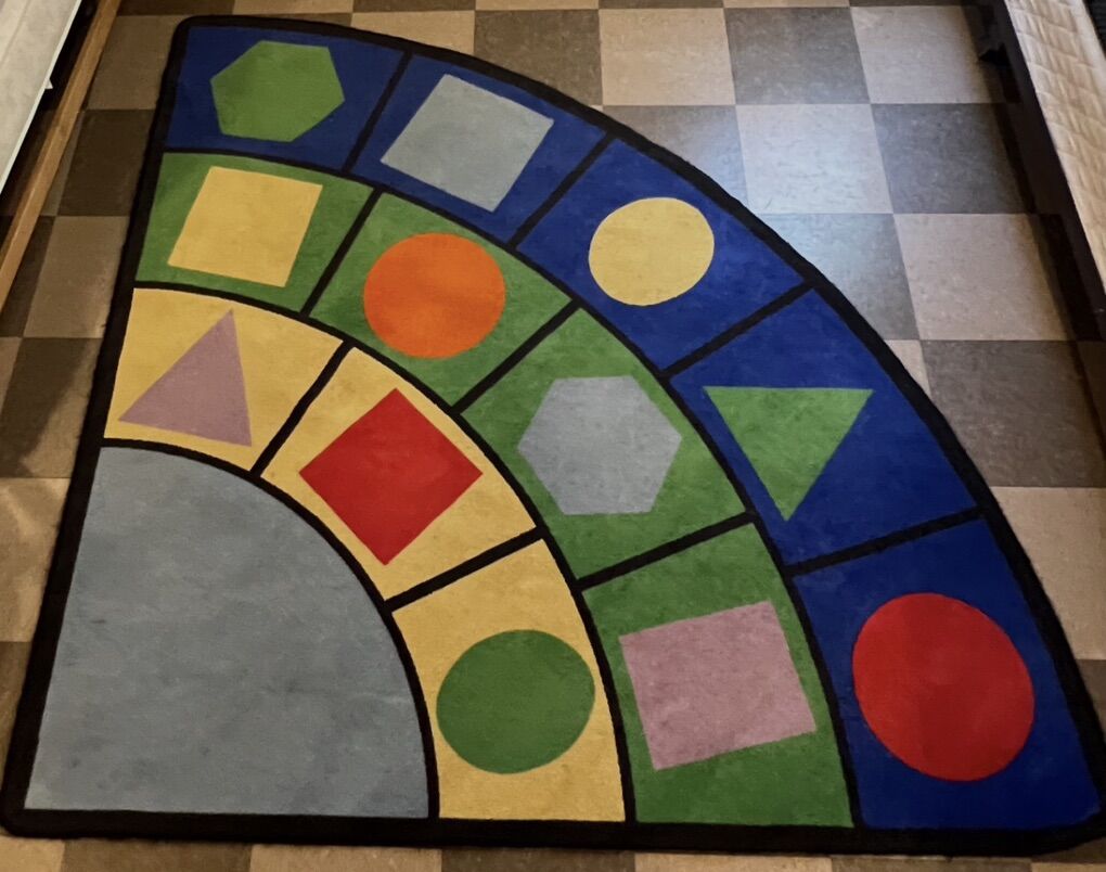 Triangle Rug With Shapes Design