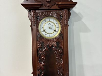 Vintage Wooden Wall Clock with Ornate Carved Detailing and Roman Numerals