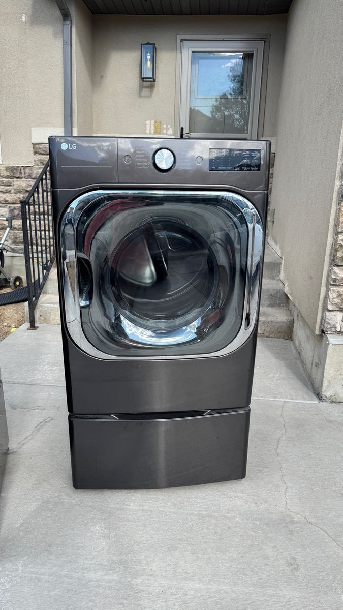LG ThinQ Washer and Dryer Set in Black Stainless Steel with Pedestals