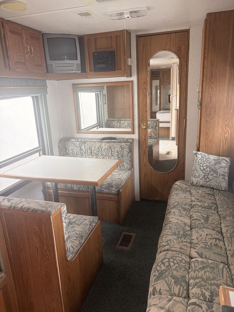 Travel Trailer RV Interior Living Area with Dinette and Sofa 2000 Sierra 
