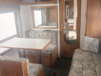 Travel Trailer RV Interior Living Area with Dinette and Sofa 2000 Sierra