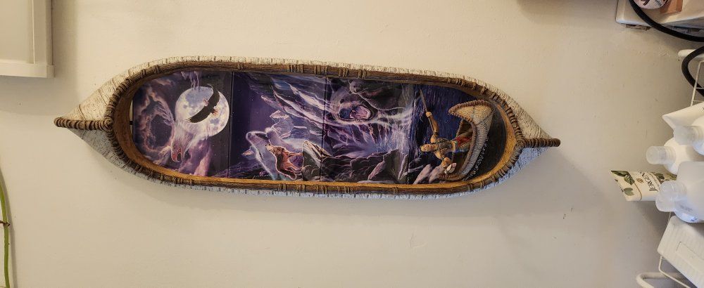 Canoe with 4 painted plates