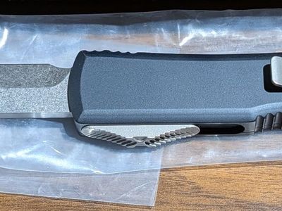 New, never carried, 25th anniversary edition Microtech Ultratech OTF