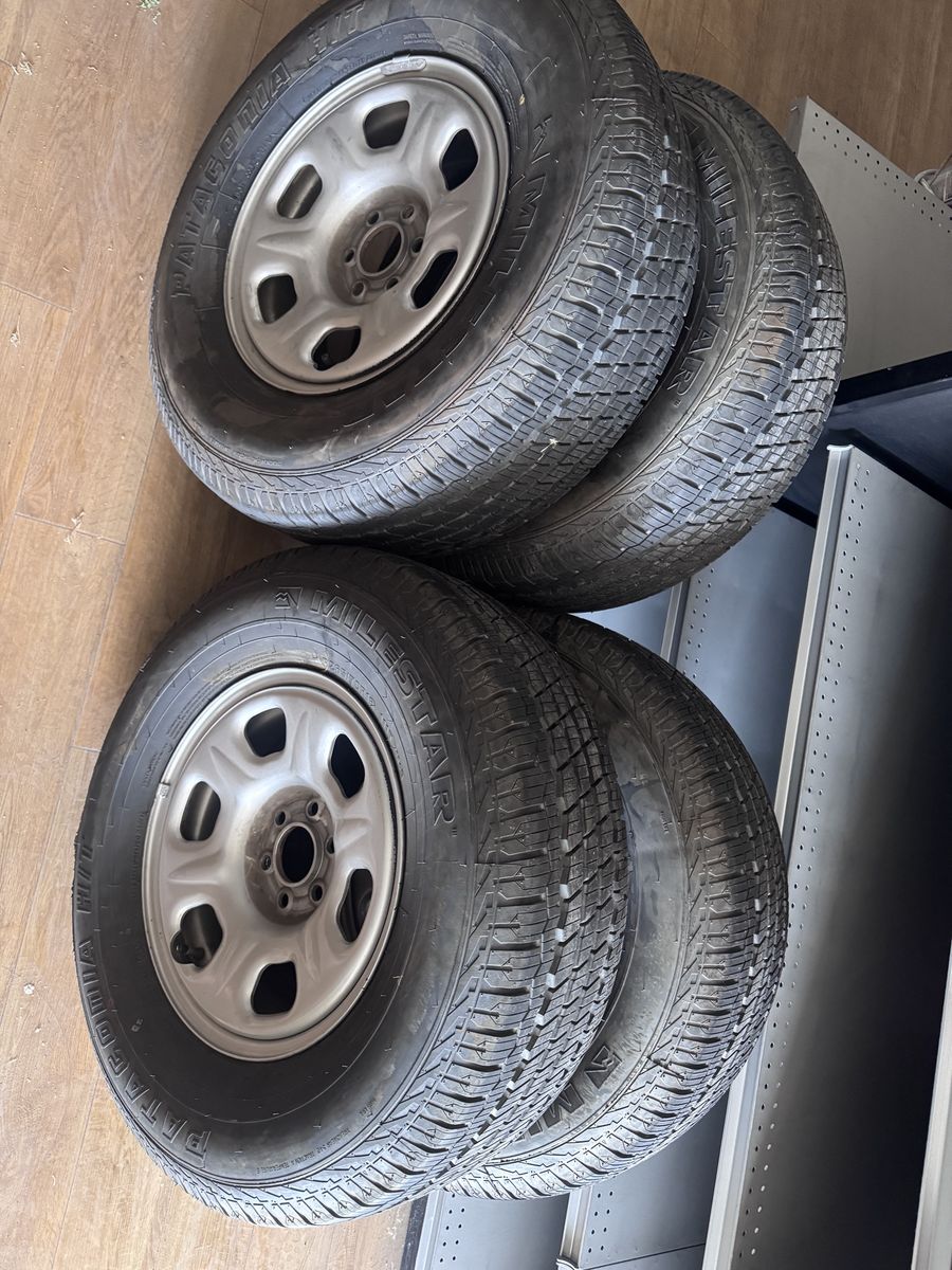 Set of 4 Milestar Patagonia H/T Tires with Nissan Frontier Steel Rims 