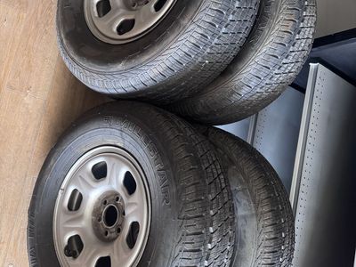 Set of 4 Milestar Patagonia H/T Tires with Nissan Frontier Steel Rims