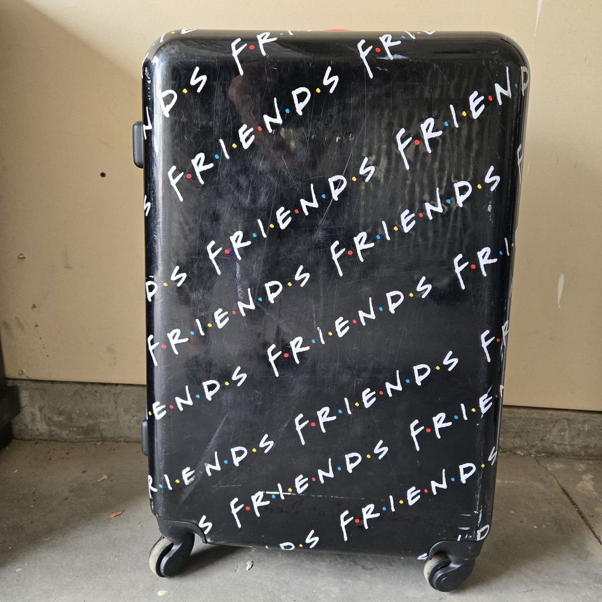 Friends themed hard shell rolling suitcase