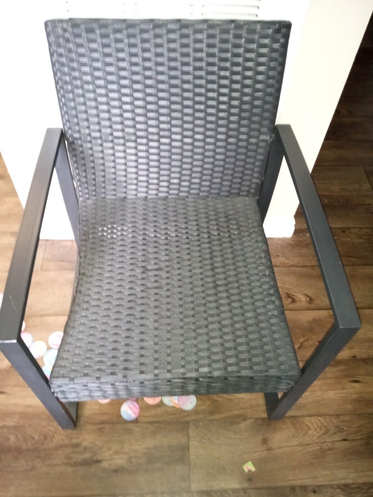 Patio chair dark brown metal and woven plastic