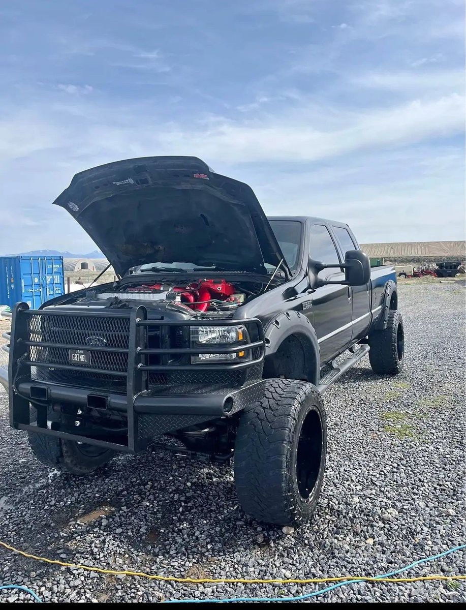 Custom Black Diesel Truck with Lift, Tint, and Performance Upgrades