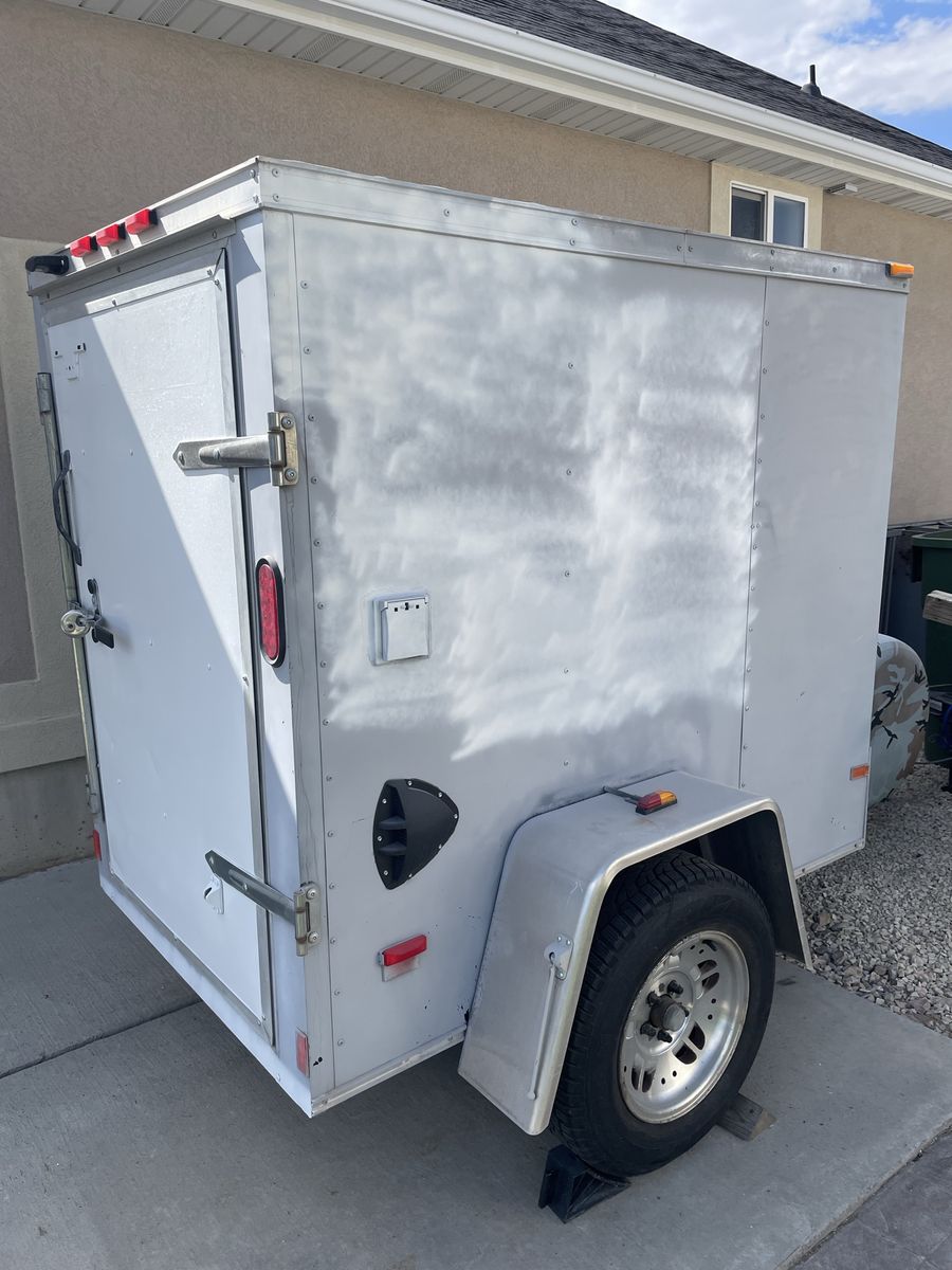 Haulmark brand 4x6 Single Axle Enclosed Cargo Utility Trailer with Rear Door & Side Vents