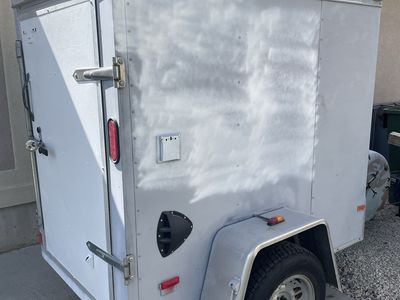 Haulmark brand 4x6 Single Axle Enclosed Cargo Utility Trailer with Rear Door & Side Vents