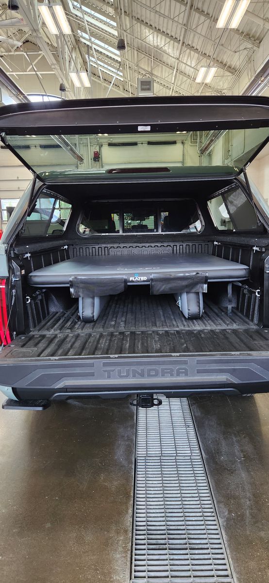 Flated truck bed deck system