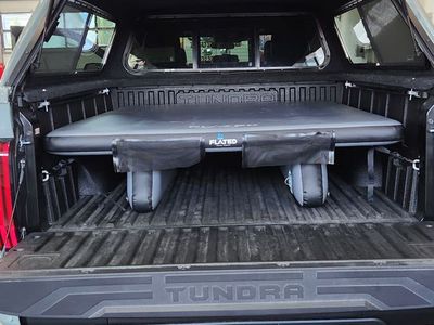 Flated truck bed deck system