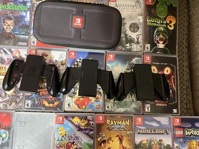 Switch games and controllers for joy cons and a switch case. Yoshis crafted world is the game without and art cover