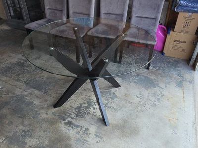Glass top dining table with 4 chairs.