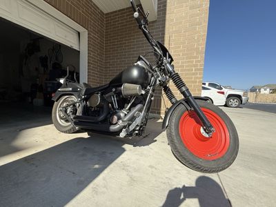 2003 Harley Davidson Soft Tail Motorcycle with Red Front Wheel and Sissy Bar