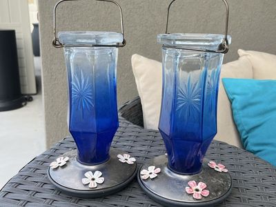 Two Beautiful Blue Glass Hummingbird Feeders.