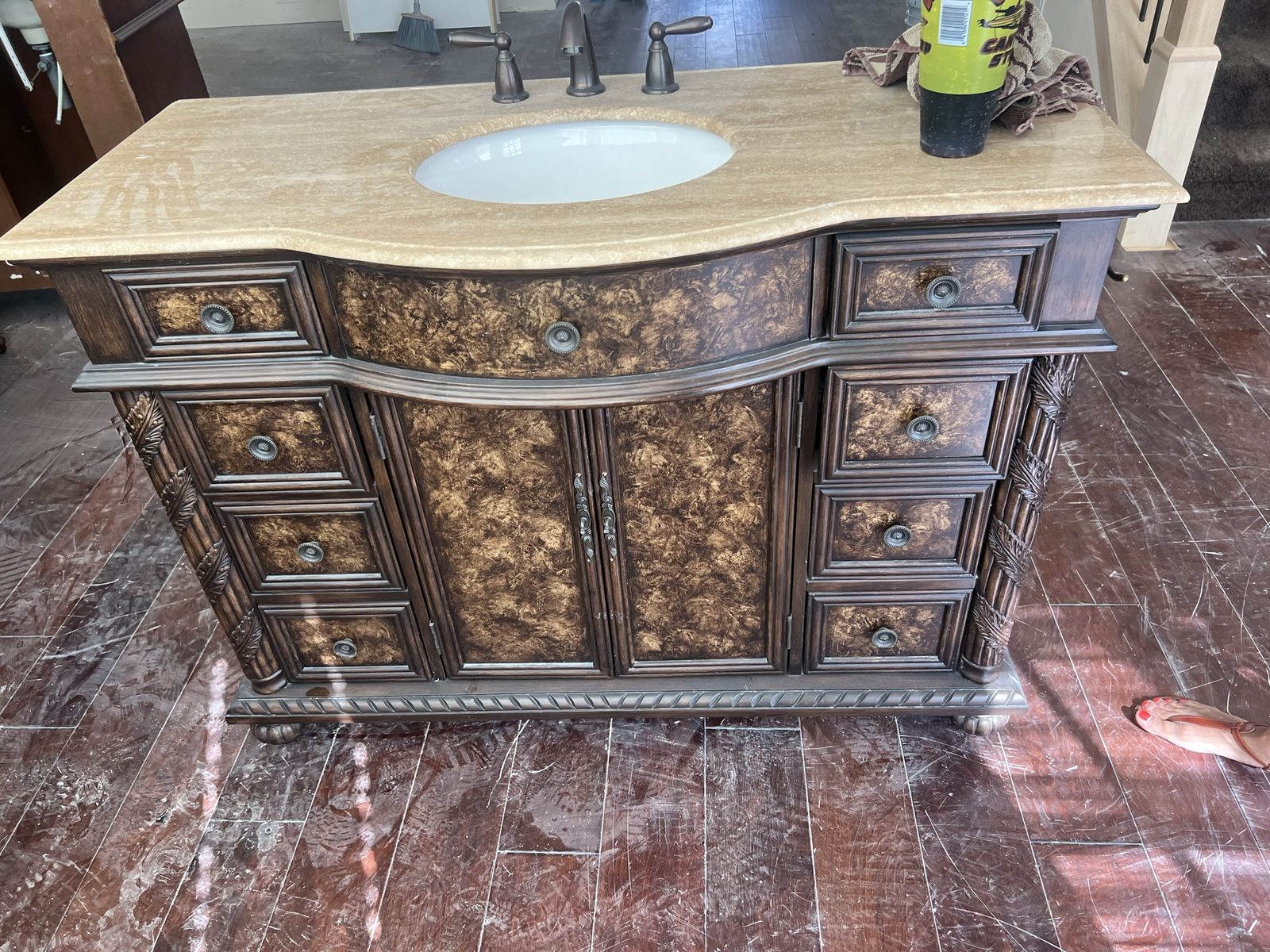 Ornate Dark Wood Bathroom Vanity with Marble Top and Multiple Drawers