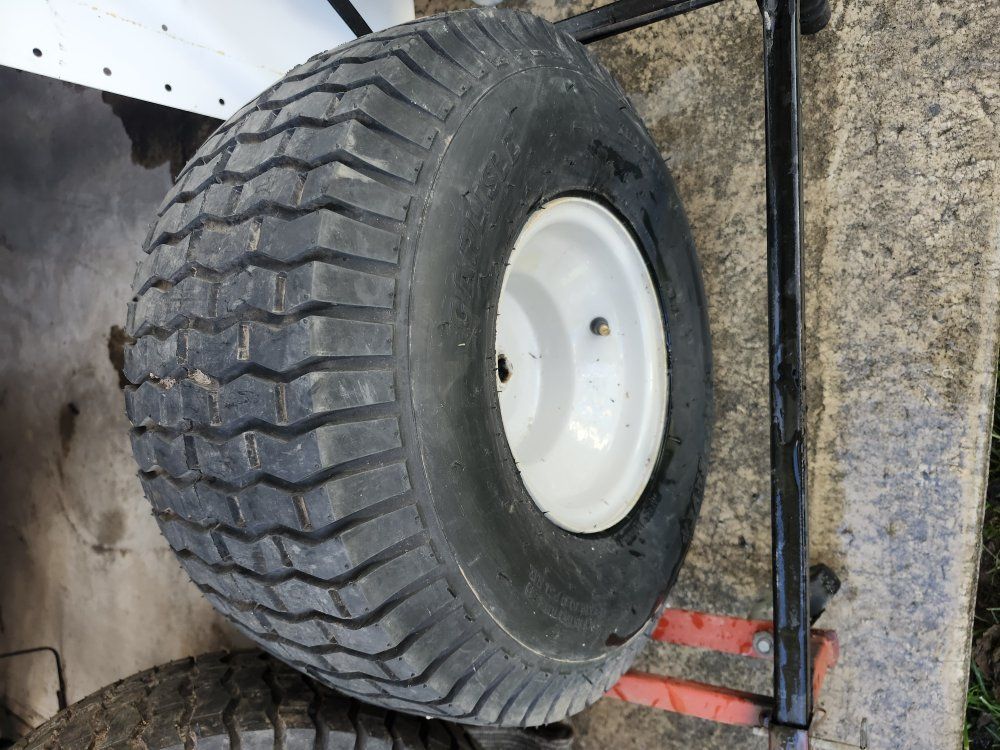 Riding lawn, mower, back wheels.